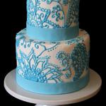 Teal Henna Design pops against white fondant